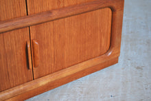 Load image into Gallery viewer, Danish Mid Century Dyrlund teak media cabinet on casters, circa 1970s
