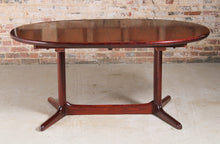 Load image into Gallery viewer, Danish Mid Century oval rosewood dining table, circa 1970s. 2 Extension leaves stored underneath, seats up to 12 people.
