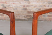 Load image into Gallery viewer, A pair of Danish Mid Century teak carver dining chairs by Johannes Nørgaard for the Nørgaards Møbelfabrik, circa 1960s.
